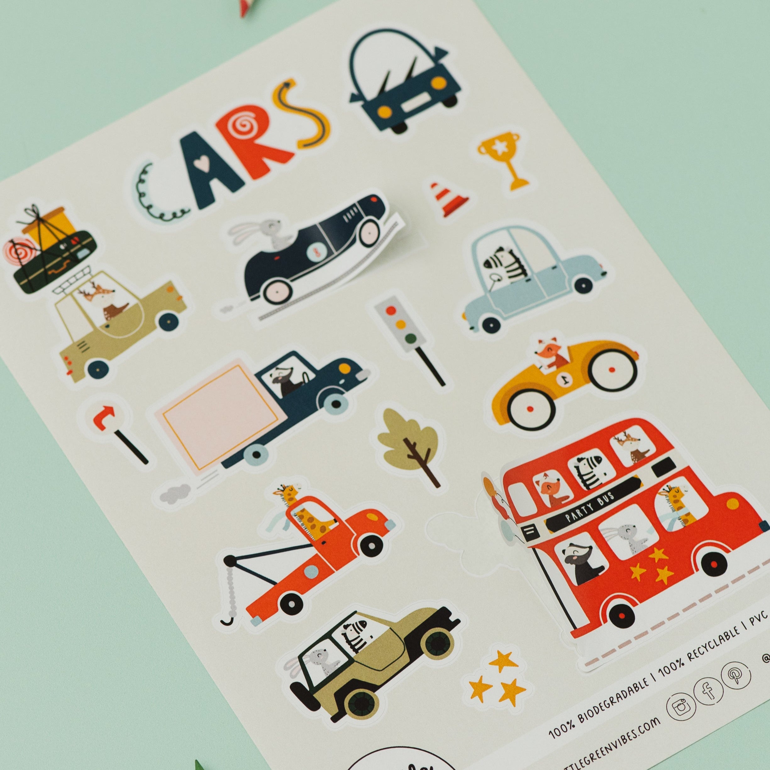 Sheet of car-themed stickers with colorful illustrations on a light green background.