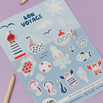 Sheet of 'Bon Voyage' themed stickers with sea-themed illustrations on a purple background.