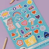 Sheet of colorful stickers with various designs on a purple background