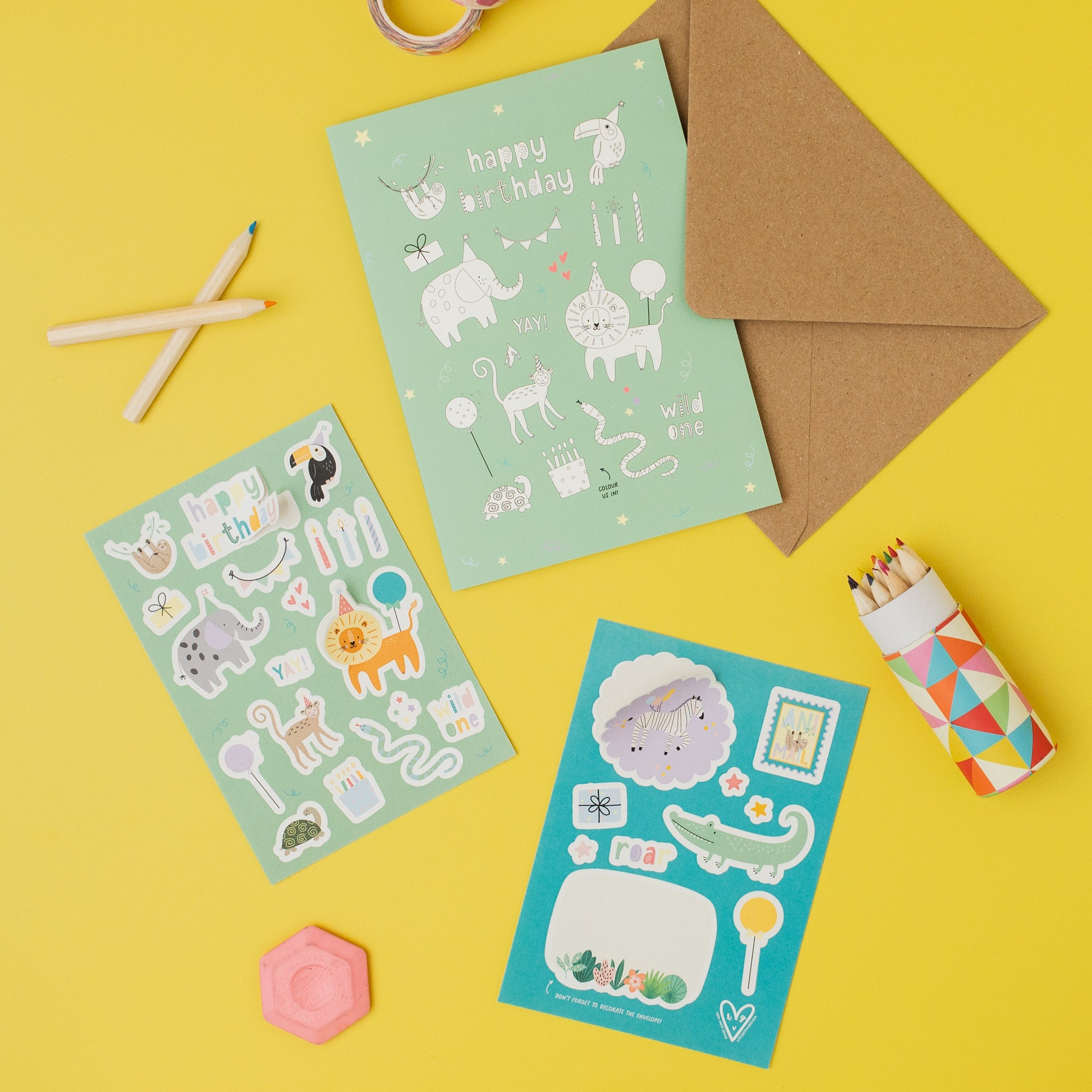 Jungle Stickers, birthday cards, and stationery items on a yellow background
