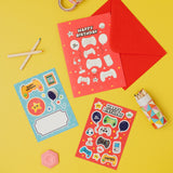 Sticker sheets with 'Happy Birthday' text and gaming-themed designs on a yellow background.