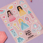 Sheet of stickers with princesses, castles, and other elements on a pink background