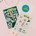 Jungle-themed sticker sheets on a pink background.