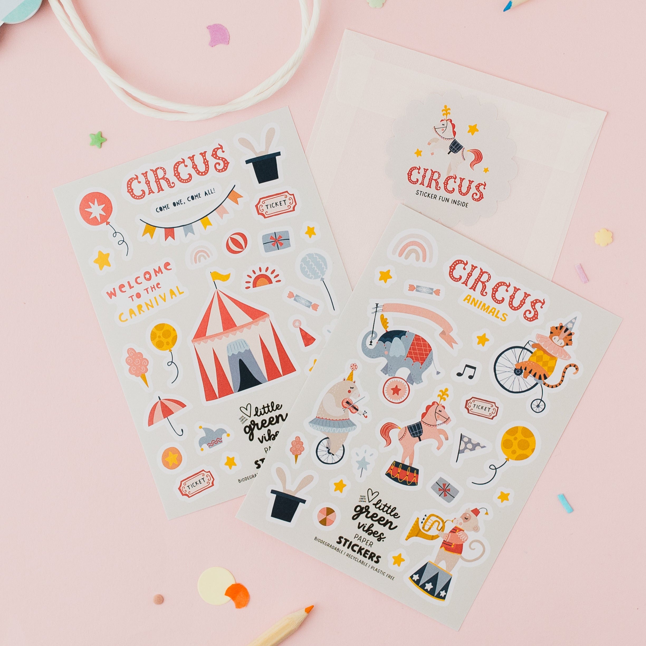 Circus-themed sticker sheets on a pink background with colourful confetti and pencils.